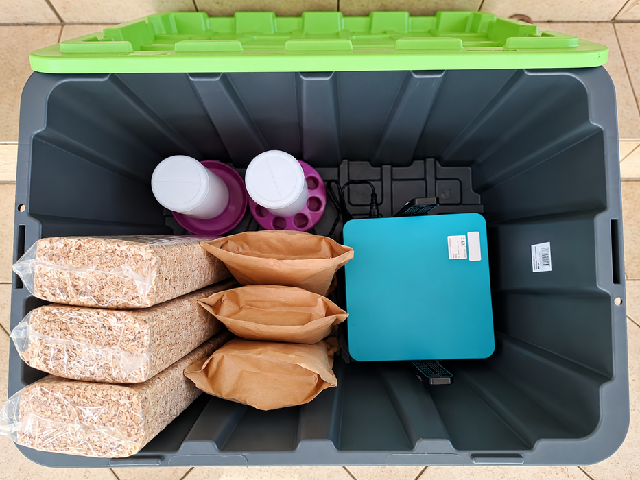 Hatching Chicks Brooder Kit: 100 L tub with three bags of sawdust bedding, three bags of chick starter, a drinker, a feeder and a brooder plate.